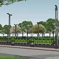 Urban Roadside Safety Railing With Lush Green And Red Leaf Trees
