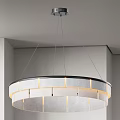 Modern Layered Ring Shaped Chandelier With Fabric Shade And Soft Lighting In Interior Space