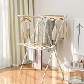 Indoor Clothes Drying Rack With Hanging Clothes Curtain And Wall Art