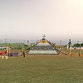 Vast Desert Landscape Featuring Traditional Building Trees And Vehicles Under Clear Sky