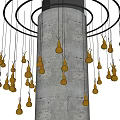 Yellow Gourd Shaped Chandelier With Black Circular Structure Around Concrete Pillar