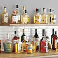 Various Wine Bottles And Glasses Arranged On Display Shelf With Different Labels And Colors