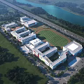 Aerial View of School Buildings With Green Sports Field Surrounding Trees and Nearby Lake