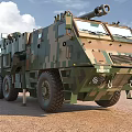 Military Functional Vehicle Featuring Camouflage Design Large Wheels And Top Mounted Weapon System