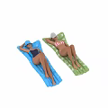 Two women lying on colorful inflatable mats wearing swimsuits and hats