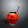 Traditional Mate Drink in Red Calabash with Green Liquid and Metal Straw