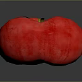 Ripe Red Tomato with Yellow Stem on Dark Background and Clear Reflection