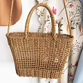 Stylish Clothing Hanger With Blue Ruffled Dress Woven Handbag And Camera Accessory