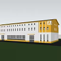 Modern Industrial Factory Building With Yellow Gray Exterior And Large Windows On Green Lawn