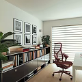 Modern Home Office Interior Design With White Desk Red Chair Potted Plant And Framed