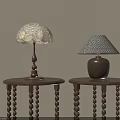 Decorative Table Lamps With Wooden Ceramic Bases And Patterned Shades On Round Beaded Leg Tables