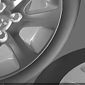 Two Car Tires With Silver Alloy Rims Displayed On Gray Background