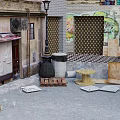 Vintage Commercial Street With Graffiti Art Colorful Buildings Awning And Roller Shutter