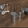 Vintage Metal Household Items Including Scale Candle Holders And Canisters On Wooden Floor