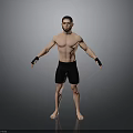 Shirtless Man in Black Shorts with Wrist Wraps Standing on Grey Background