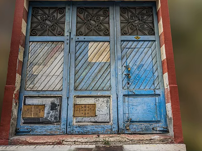 Weathered Blue Entrance Door With Decorative Patterns Striped Panels Bronze Plates And Red Frame 3d model