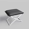 Modern Black Cushioned Ottoman With Metal X Shaped White Legs Design