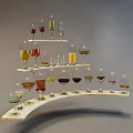 Multi tiered Display Stand With Assorted Wine Glasses And Different Colored Liquids