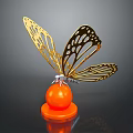 Golden Butterfly Metal Sculpture With Orange Round Base And Intricate Wing Design