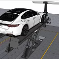 White Car Being Serviced On Hydraulic Lift In Auto Repair Garage
