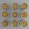 Nine Car Wheel Rims With Various Gold And Silver Designs Arranged In