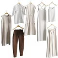 Light Colored Clothes Hanging On Rack Featuring Dresses Tops And Pants
