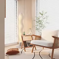 Cozy Lounge Chair With Wooden Frame White Cushion Side Table Potted Plant And Window Blinds