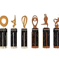 Decorative Ornament Set With Golden Sculptural Designs And Black Marble Bases