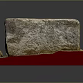 Handmade Wood and Stone Craft Pieces with Rough Surfaces on Red Display Base