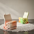 Two Playful Children's Chairs With Spiral Design And Colorful Gradient On White Rug