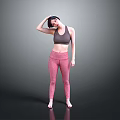 A Woman Adjusting Her Hair In Gray Sports Bra And Pink Leggings