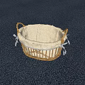 Wicker Storage Basket With Light Fabric Lining And White Lace Trim On Dark Carpet