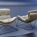 Modern Beige Leather Armchairs With Black Metal Frame For Interior Decor