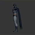 Batman Character in Blue Gray Costume With Yellow Belt Cape and Mask Standing Arms Outstretched
