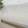 Venetian Blinds Filtering Natural Light Through Large Windows In Modern Room With Potted Plant