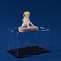 Doll Figure Sitting with Blonde Twin Tails on Purple Base in Clear Acrylic Display Case