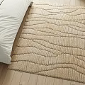 Beige Square Rug With Wavy Pattern On Bedroom Wooden Floor Near White Bed