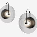 Modern Circular Wall Sconces With Striped Metallic Shade And Warm Ambient Lighting