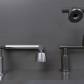 Various Stylish Faucets Displayed On Gray Shelves With Different Designs And Finishes