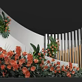 Floral Display With Orange Flowers Green Foliage Curved White Wall And Vertical Slats