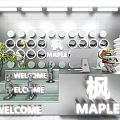 Modern MAPLE Specialty Store Interior With Welcome Signs Plants And Figurines