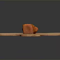 Three Orange Food Chunks Arranged On Wooden Cutting Board Surface