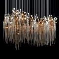 Modern Artistic Chandelier With Glass Pendant Strands And Gold Accents Illuminated