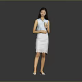 Woman standing in blue sleeveless top and white lace skirt holding cup against gray background