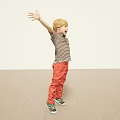 Boy With Arms Outstretched In Striped Shirt Red Pants And Sneakers