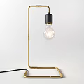 Minimalist Black Metal Table Lamp with Curved Stand and Transparent Bulb for Home Office