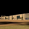 Modern Industrial Factory Building Exterior With Large Glass Windows Trees And Open Ground