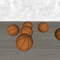 Scattered Basketballs As Sports Equipment On Light Wooden Floor With White Wall