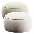 Two Beige Round Fabric Ottomans with Soft Surface for Modern Minimalist Home Decor