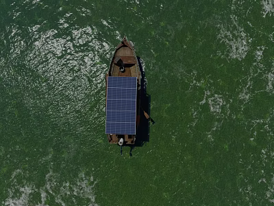 Small Boat With Solar Panel Floating On Green Water Surface 3d model